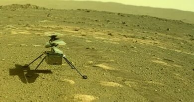 Photograph taken by the Perseverance rover's rear Hazard Camera on April 4, 2021, showing NASA's Ingenuity helicopter on the Martian surface