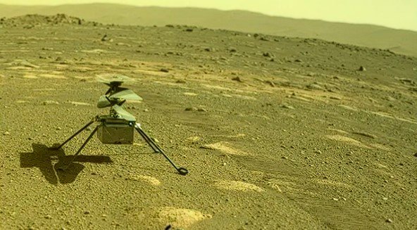 Photograph taken by the Perseverance rover's rear Hazard Camera on April 4, 2021, showing NASA's Ingenuity helicopter on the Martian surface